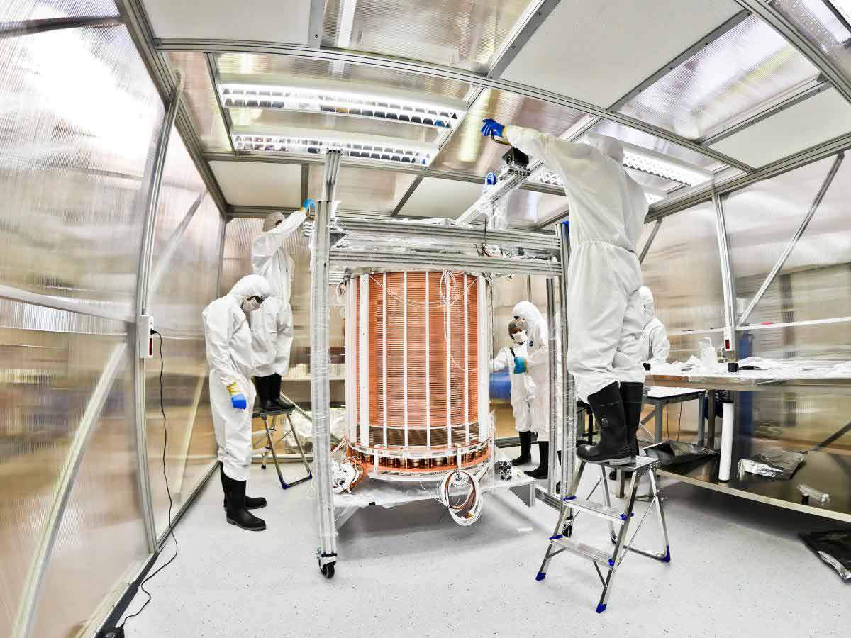People in cleanroom gear working on the XENON1T TPC