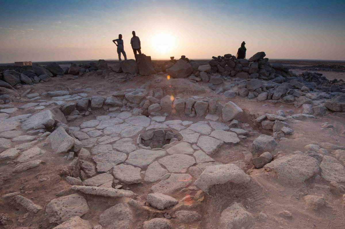 Drs. Elisabetta Boaretto and Tobias Richter. In the foreground is a Natufian hearth at Shubayqa, Jordan