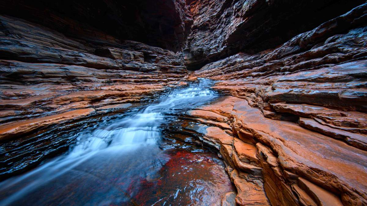 The iron-rich ancient rocks of the Pilbara region in northwestern Australia. Life on Earth may have first emerged on magnetic surfaces at the bottoms of primordial lakes. Photo: Shutterstock