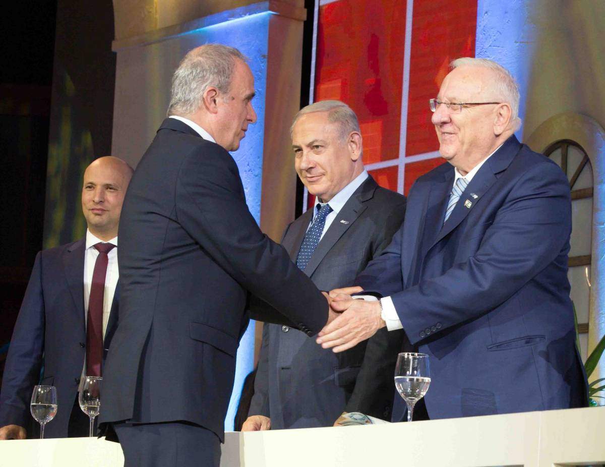 Prof. Yosef Yarden receives the Israel Prize from (l-r) Minister of Education Naftali Bennet, Prime Minister Benjamin Netanyahu and President Reuven Rivlin