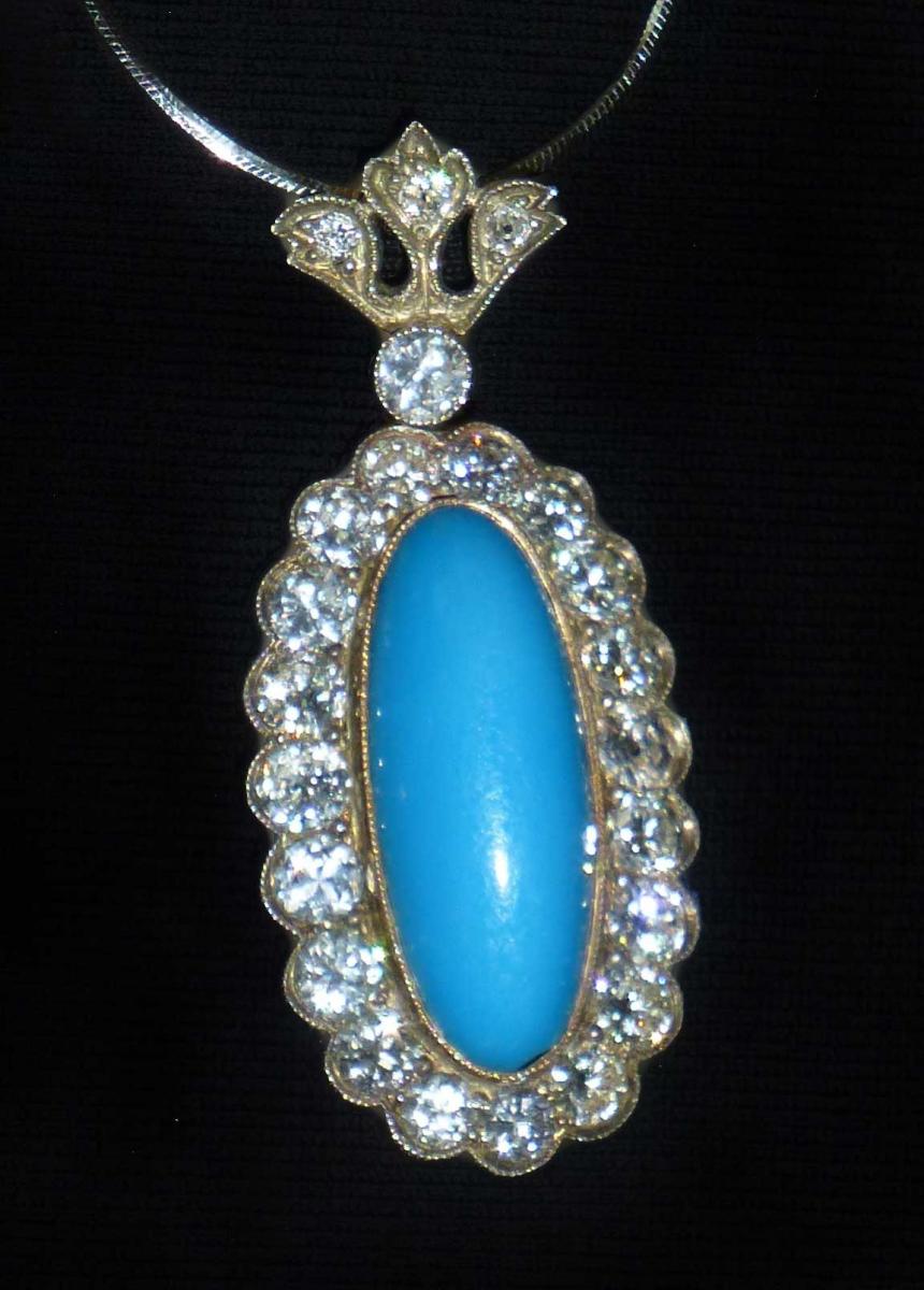 Lillian’s pendant. A turquoise inset is surrounded by 20 small diamonds