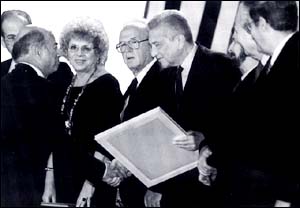 Prof. Sharon shakes hands with the President of Israel, Mr. Ezer Weizman at the Israel Prize Ceremony. To Weizman's left are Prime Minister Yitzhak Rabin and Minister of Science and the Arts Shulamit Aloni