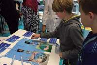 Children try out the Israeli exhibit