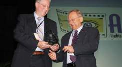 Chair of ASTC's Leading Edge Awards Selection Committee Dr. Dennis Schatz presenting the award to Dr. Moshe Rishpon