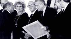 Prof. Sharon shakes hands with the President of Israel, Mr. Ezer Weizman at the Israel Prize Ceremony. To Weizman's left are Prime Minister Yitzhak Rabin and Minister of Science and the Arts Shulamit Aloni